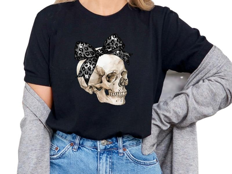 Skull with Cheetah Bow Women's Top, Graphic Shirt, Skull Shirt, Tie Dye Shirt, Casual Cotton Shirt for Women, Graphic Tee, Sarcastic, Womenswear, Streetwear, Tshirt Crewneck Short Sleeve Adult Homor T-Shirt, Leopard Print, Cheetah Print, Halloween Shirt
