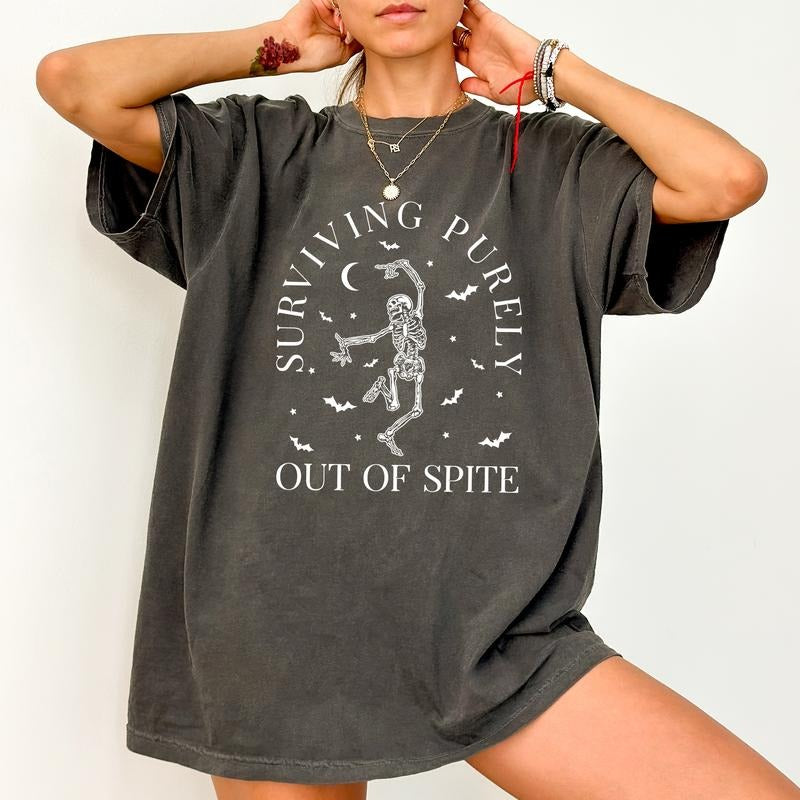 Surviving Purely Out Of Spite Tee, Funny Gothic Skeleton And Bats T-shirt, Spooky Season Unhinged Shirt, Funny Shirts For Women, Gothic Boho Halloween Tee, Comfy Fabric Graphic Tee, Women's Tops, Womenswear, Cotton Fabric Relaxed Fit Chic Style
