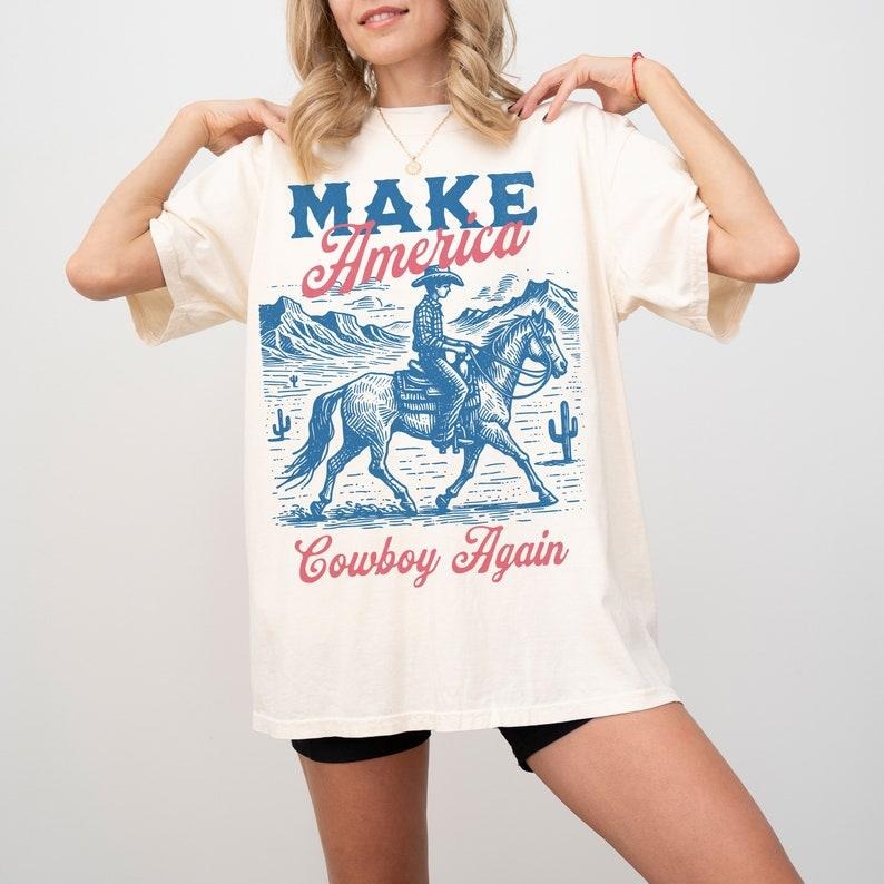 Make America Cowboy Again 4th of July Western Rodeo Shirt, Cowboy Shirt, Country Shirt, Western Graphic Tee, Western Gifts, Western Hoodie, T-shirt and sweater